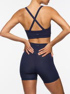 Lifestyle view of the Olessa Essential Bamboo Bralette - Navy: Gentle on your skin and the planet with a feel-good fit.